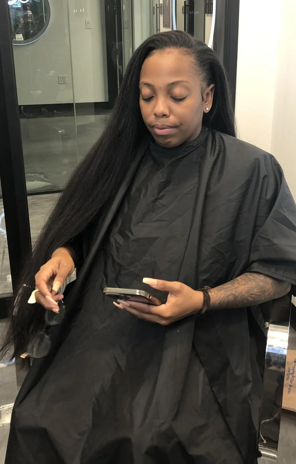 Long straight hair extensions with a sleek polished finish in Dallas, Texas.