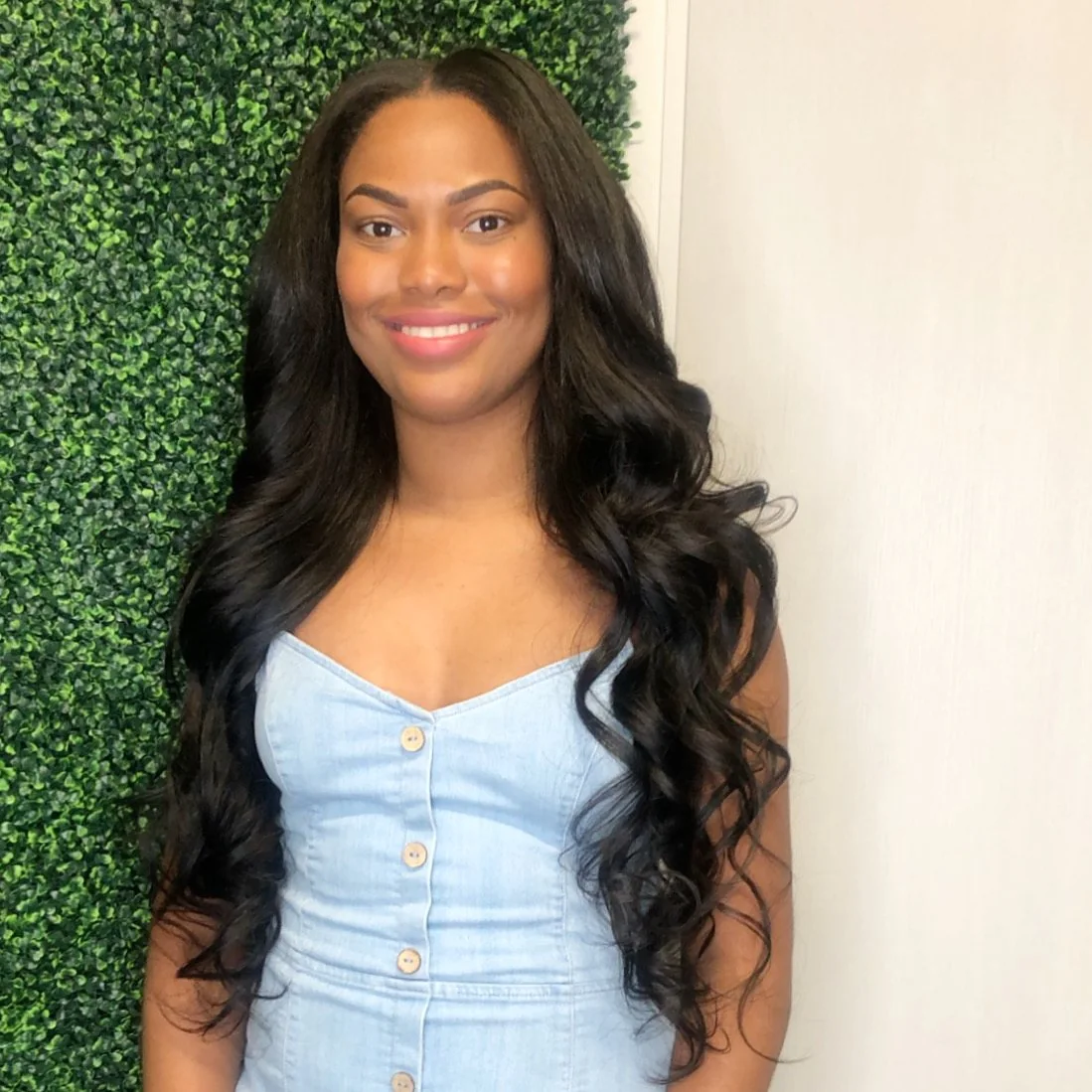 Natural-looking wavy hair extensions with soft curls in Dallas, Texas.